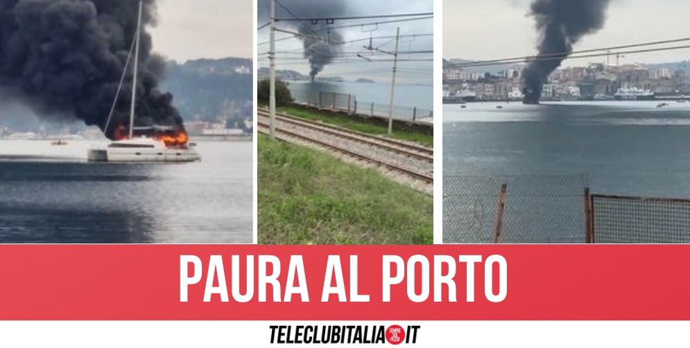 incendio al porto di pozzuoli, barca in fiamme: enorme colonna di fumo si alza in cielo